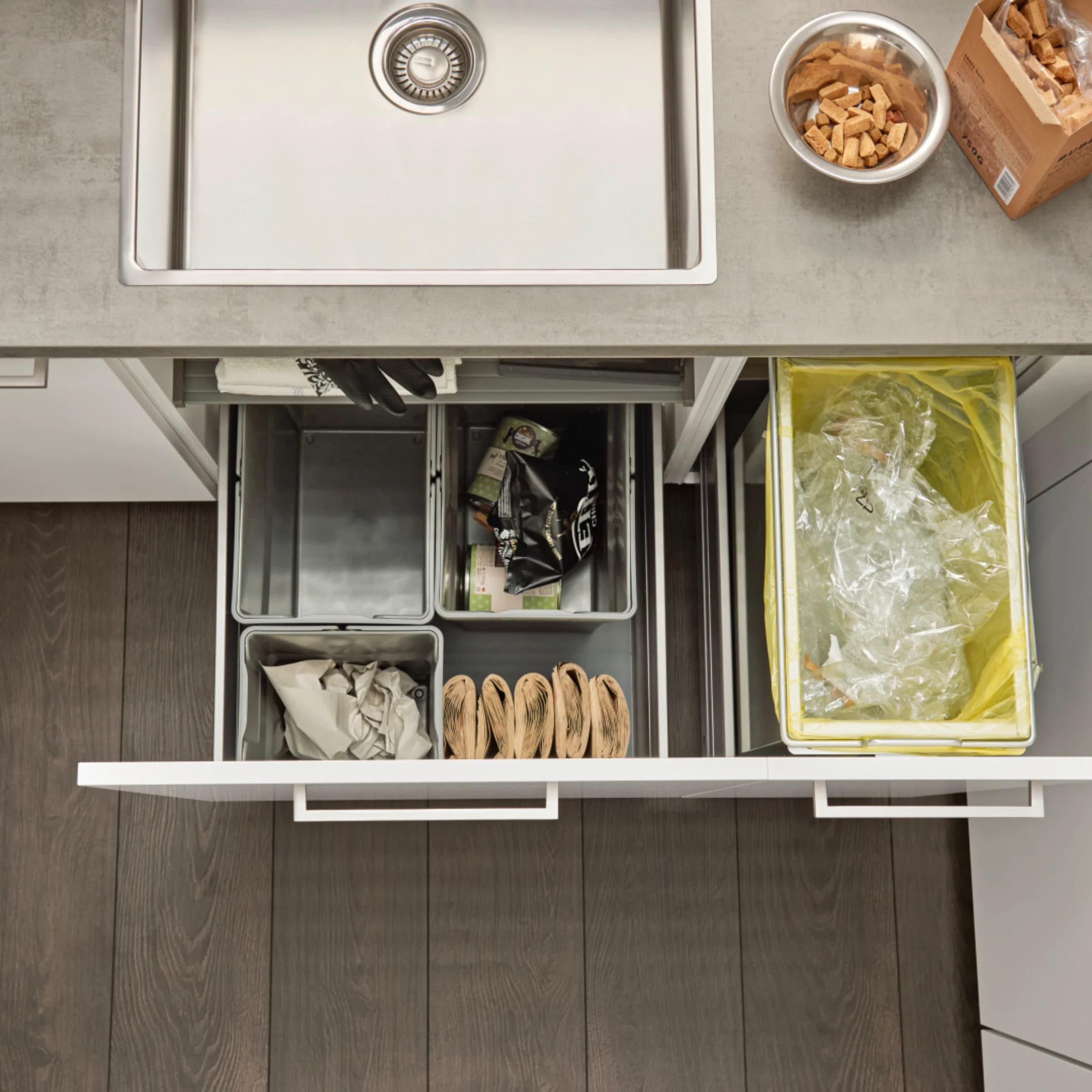 A modern kitchen sink with a waste sorting system underneath, Nolte Kitchen.