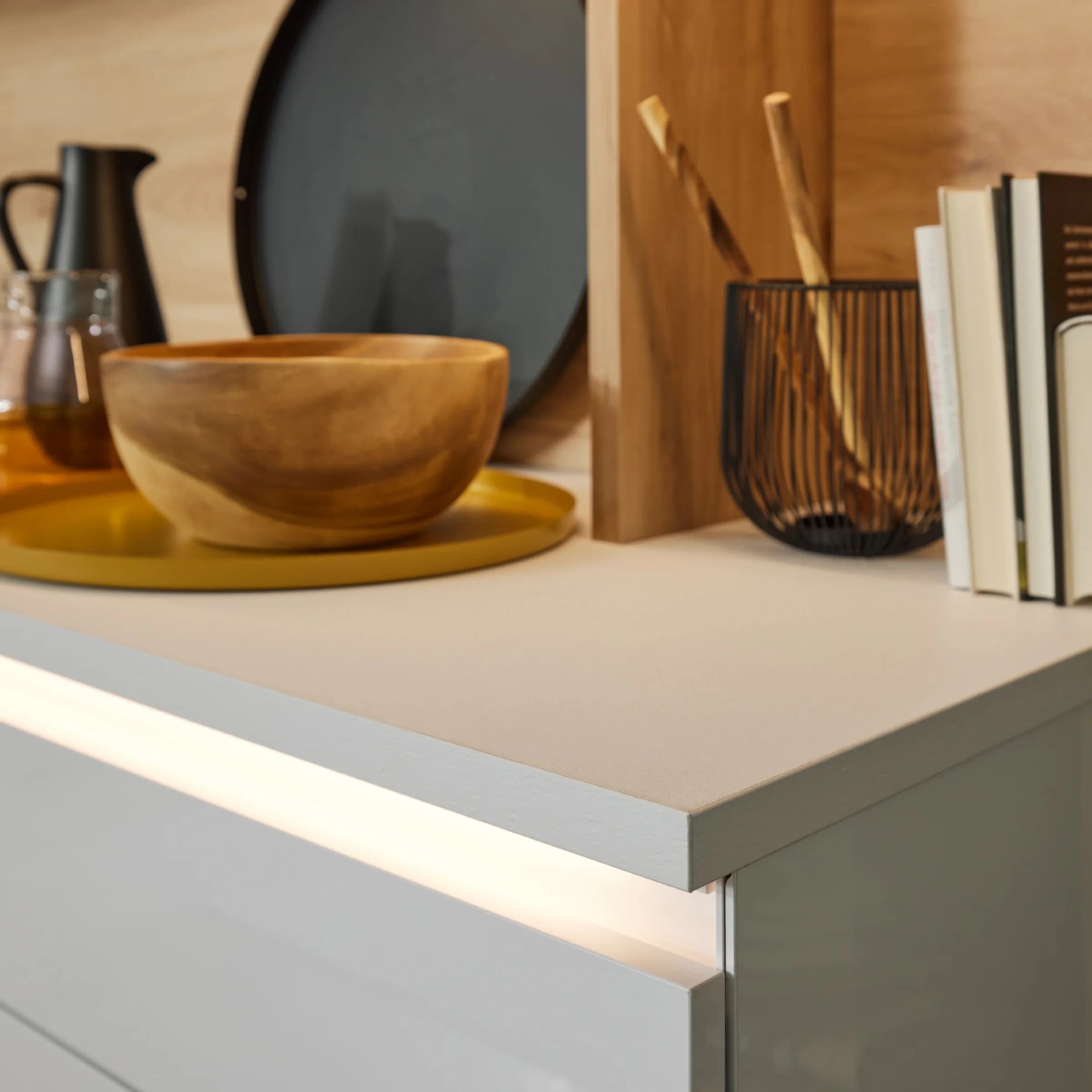 A modern kitchen countertop with stylish decor by Nolte Kitchen.