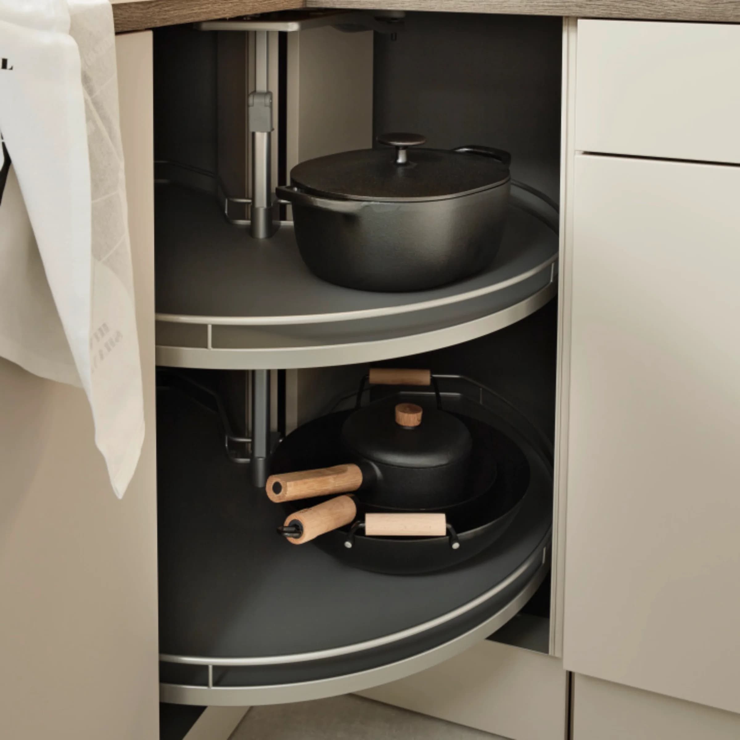 Modern kitchen with corner cabinet and pots featuring Nolte Kitchen.